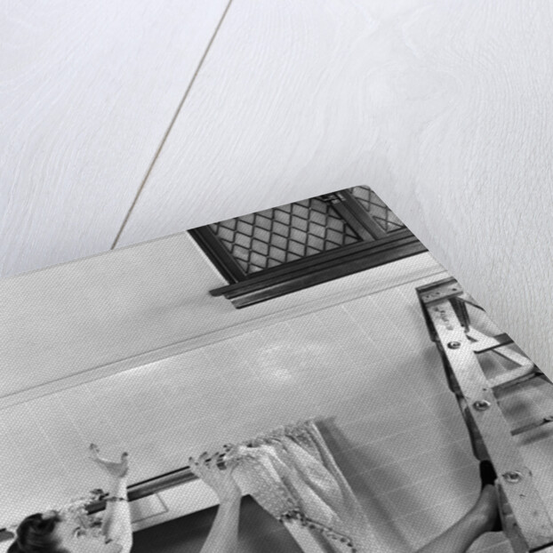 1940s Woman Housewife Falling From Step Ladder In Kitchen While Washing Window by Anonymous