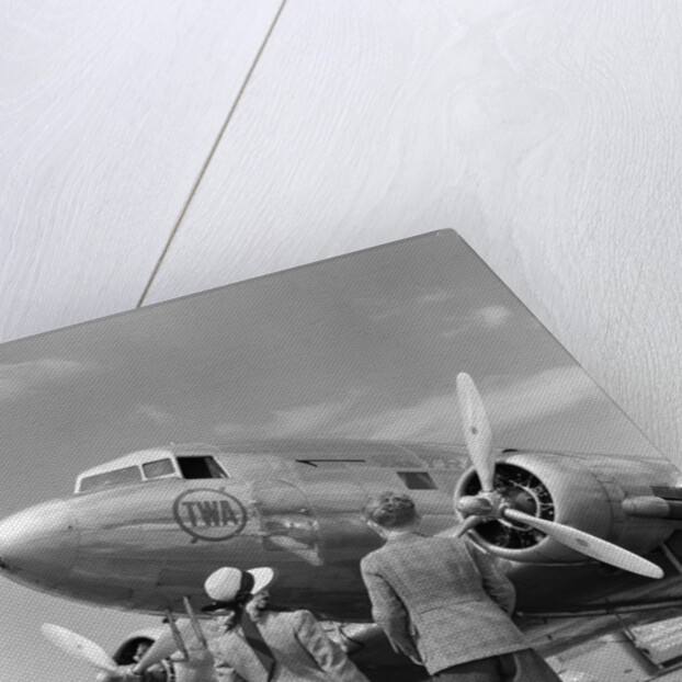 1940s Rear View Of Boy and Girl Standing Together Looking At Propeller Airplane Outdoor by Anonymous