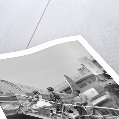 1950s Family Boarding Propeller Airliner By Climbing Gangway Stairs At Airport by Anonymous