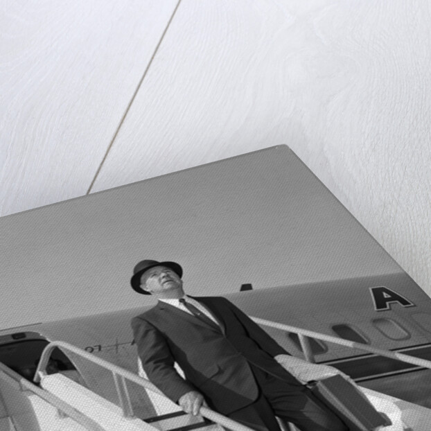 1960s Businessman Deplaning From Airplane Wearing Hat And Carrying Overcoat And Briefcase by Anonymous