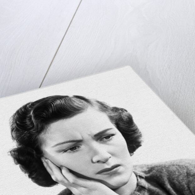 1940s Worried Woman Frowning Holding Hand To Cheek by Anonymous