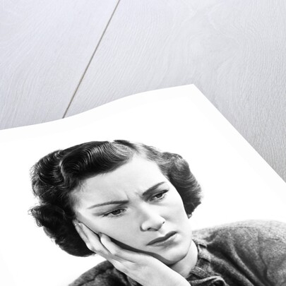 1940s Worried Woman Frowning Holding Hand To Cheek by Anonymous