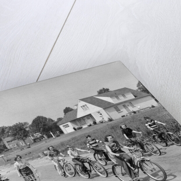 1950s 8 Kids Boys and Girls Ride Bicycles On Country Rural Road Lane Fun House In Background by Anonymous