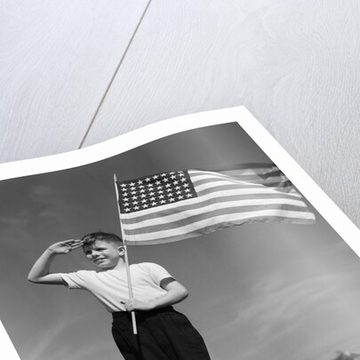 1940s Boy Holding American Flag Saluting Wearing Short Pants by Anonymous
