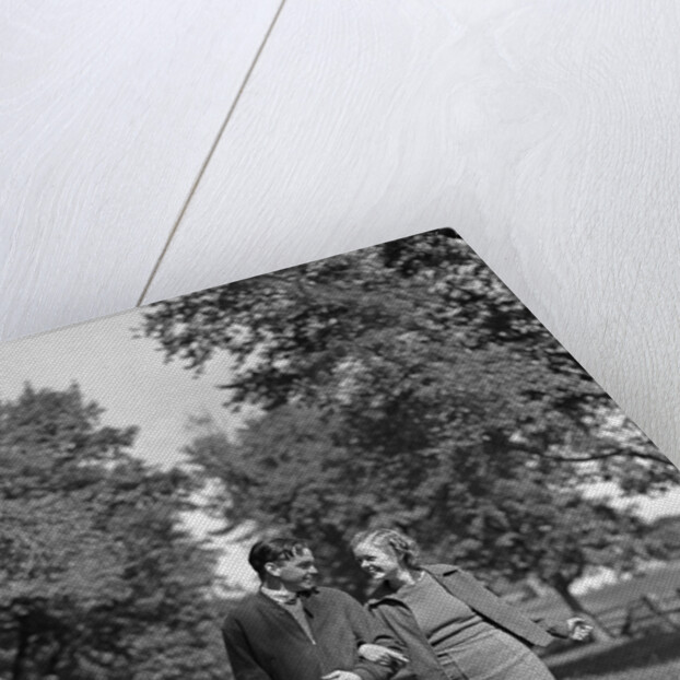 1930s 1940s Young Teen Couple Boy Girl Strolling Down Autumn Country Lane Arm In Arm by Anonymous