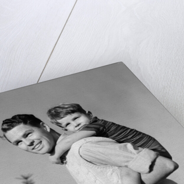 1940s Father Carrying Son Piggyback On Back by Anonymous