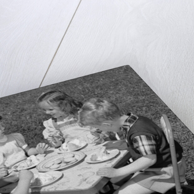 1950s Boys and Girls At Table Eating Cookies and Ice Cream For Birthday Party by Anonymous