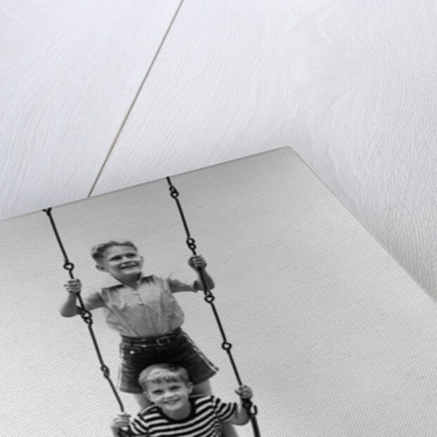 1930s Two Boys Sitting Standing On Playground Swing by Anonymous