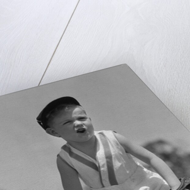 1930s Boy Wearing Baseball Hat and Glove Bent Over With Hands On Knees Yelling by Anonymous
