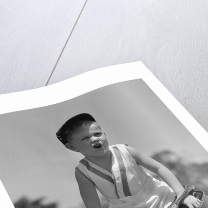 1930s Boy Wearing Baseball Hat and Glove Bent Over With Hands On Knees Yelling by Anonymous