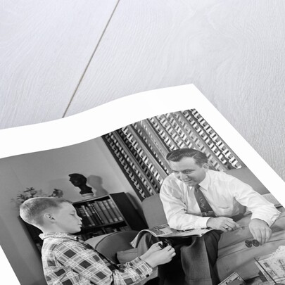 1950s Father And Son Playing With Cowboy Toy Game In Living Room Indoor by Anonymous
