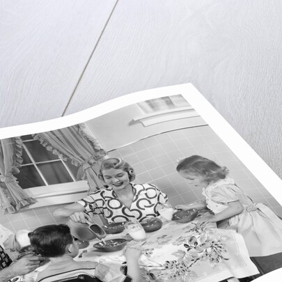 1950s Family Sitting At Kitchen Table Having Breakfast by Anonymous