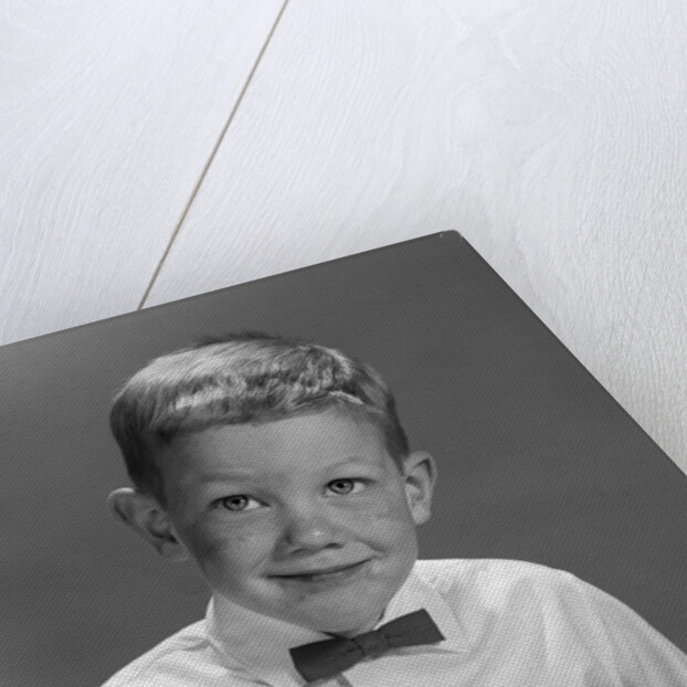 1960s Boy Wearing Bow Tie Eating Pie Dessert With Fork by Anonymous