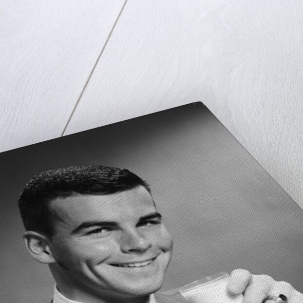 1960s Young Man Holding Glass Of Milk by Anonymous