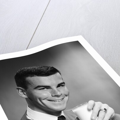 1960s Young Man Holding Glass Of Milk by Anonymous