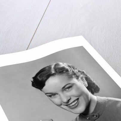 1950s Portrait Woman Holding A Glass Of Milk Studio by Anonymous