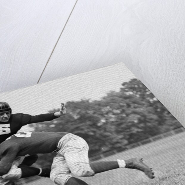 1940s Football Player Being Tackled by Anonymous