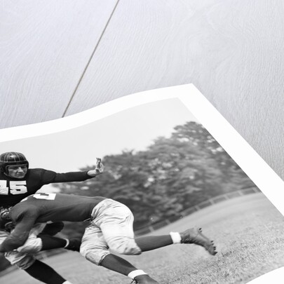 1940s Football Player Being Tackled by Anonymous