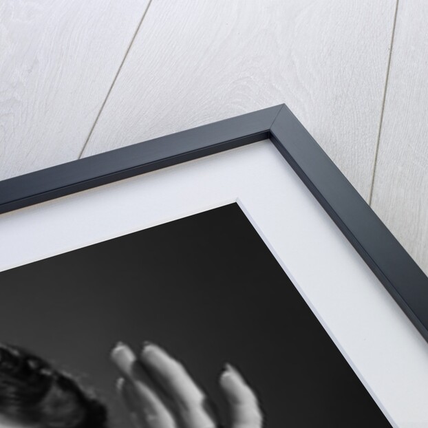 1950s Happy Woman Holding Hands Up Beside Her Head by Anonymous