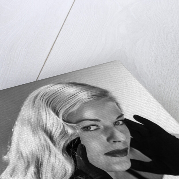 1950s Portrait Of Glamorous Woman With Long Black Gloved Hands Touching Cheek by Anonymous