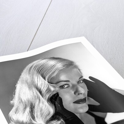 1950s Portrait Of Glamorous Woman With Long Black Gloved Hands Touching Cheek by Anonymous