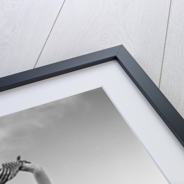 1950s 1960s Young Woman Bending Back Holding Scarf In The Wind Standing On Grassy Beach Dune by Anonymous