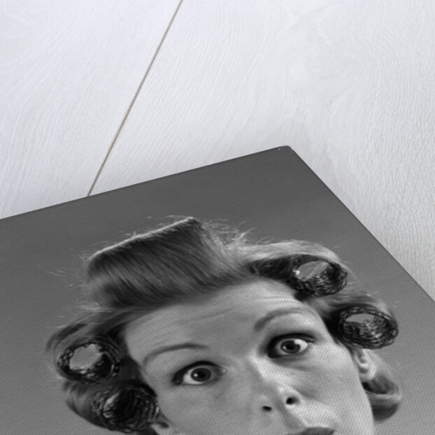 1960s Portrait Woman With Hair In Rollers Eyes Wide With Suprise by Anonymous