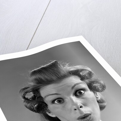 1960s Portrait Woman With Hair In Rollers Eyes Wide With Suprise by Anonymous