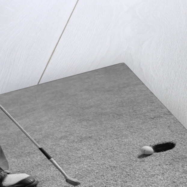 1950s Man Knees Down Putt On Golf Green by Anonymous