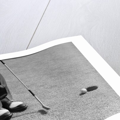 1950s Man Knees Down Putt On Golf Green by Anonymous
