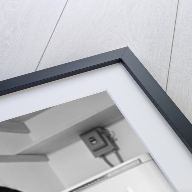 1950s Woman Kneeling Removing Clothes Laundry From Automatic Dryer by Anonymous