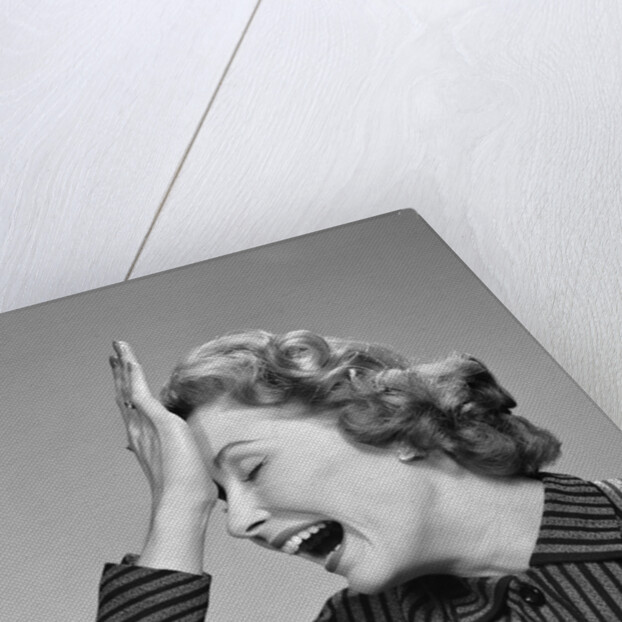 1950s Woman Hitting Forehead With Heel Of Hand by Anonymous