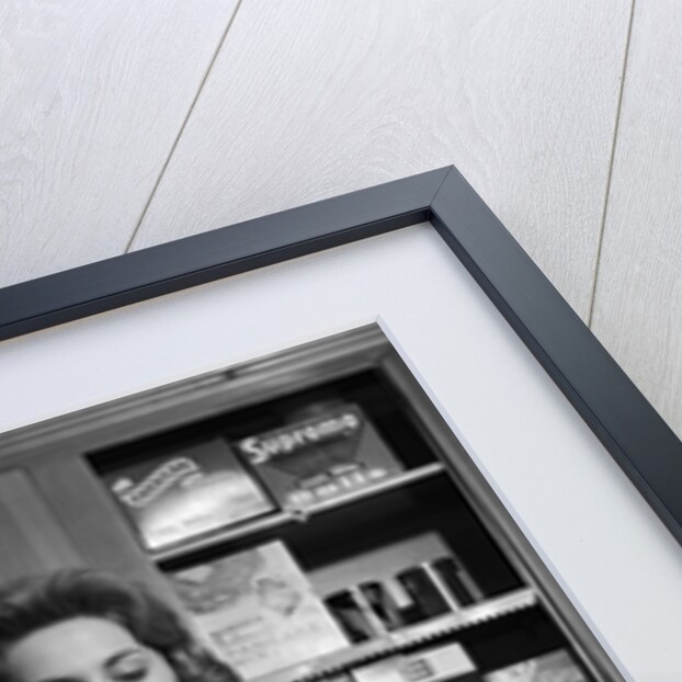1960s Woman Housewife In Kitchen Checking Grocery Food Shopping List by Anonymous