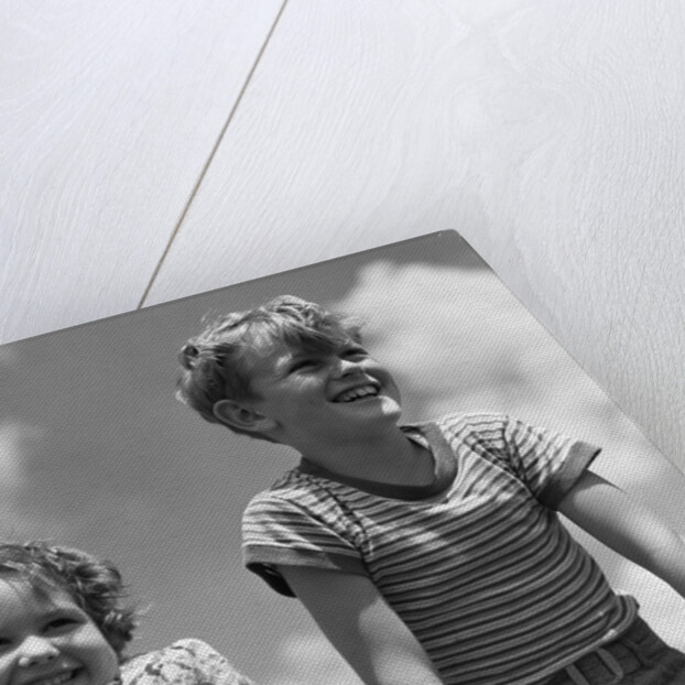 1930s Boy And Girl Bright Summer Day Sky With Clouds by Anonymous