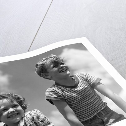 1930s Boy And Girl Bright Summer Day Sky With Clouds by Anonymous