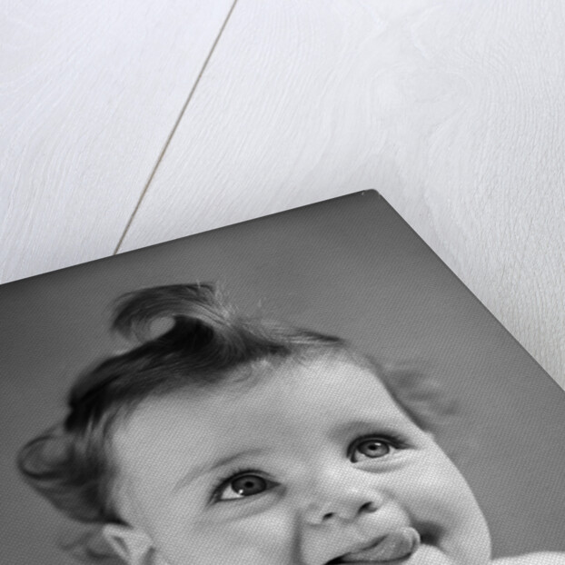 1940s Baby Girl Sticking Out Her Tongue by Anonymous