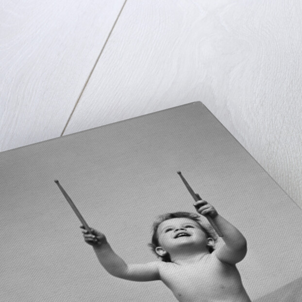 1940s Baby In Diaper With Drum Holding Up Drumsticks by Anonymous