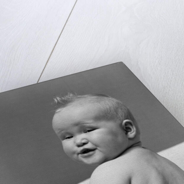 1940s Baby In Diaper Looking Back Over Shoulder With Funny Facial Expression by Anonymous