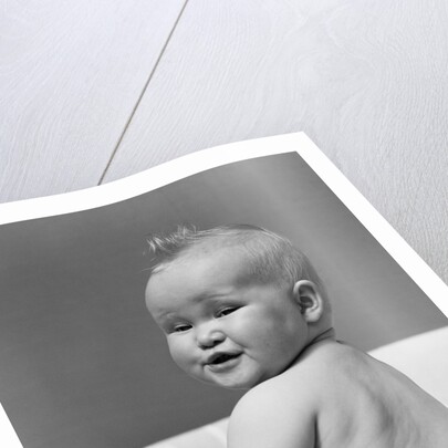 1940s Baby In Diaper Looking Back Over Shoulder With Funny Facial Expression by Anonymous