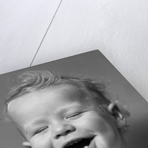 1940s Portrait Baby With Messy Hair Laughing With Eyes Closed by Anonymous