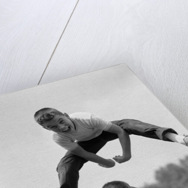 1960s Retro Boys Playing Leap Frog Outside Sky Grass Jump Jumping Crouching by Anonymous