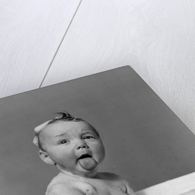 1940s Wet Baby In Bath Covered With Soap Suds Sticking Out Tongue by Anonymous