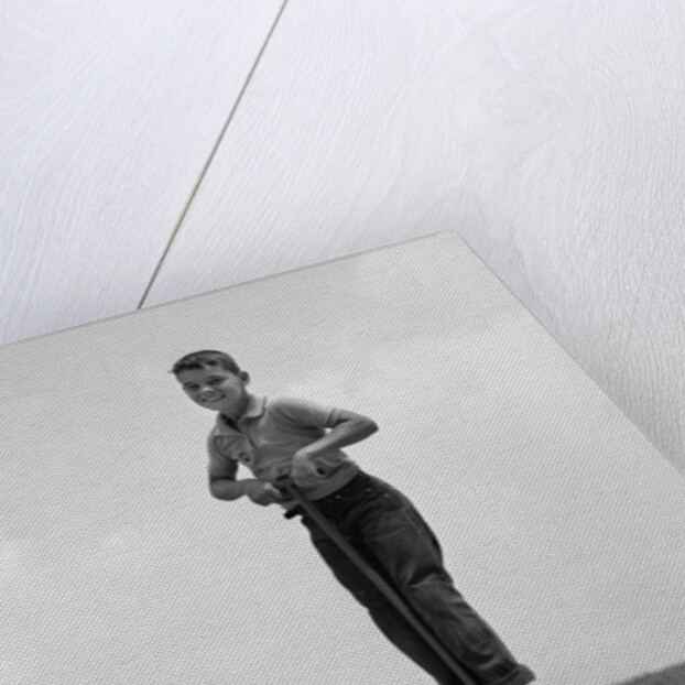 1960s Boy Jumping On Pogo Stick by Anonymous