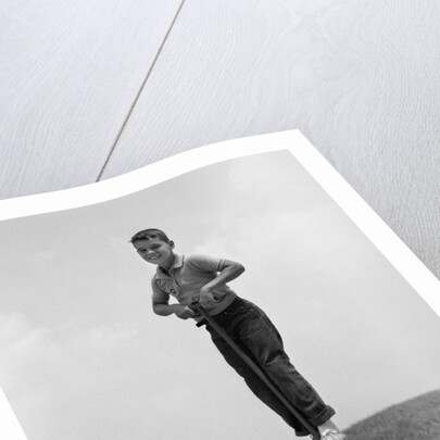 1960s Boy Jumping On Pogo Stick by Anonymous