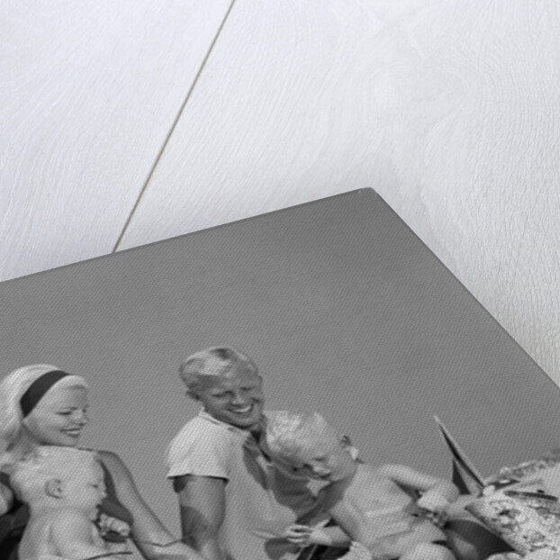 1970s 1960s Family Father Mother Twin Sons Playing In Sand On Beach Outdoor by Anonymous