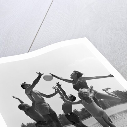 1960s Family Jumping Playing Beach Volleyball by Anonymous