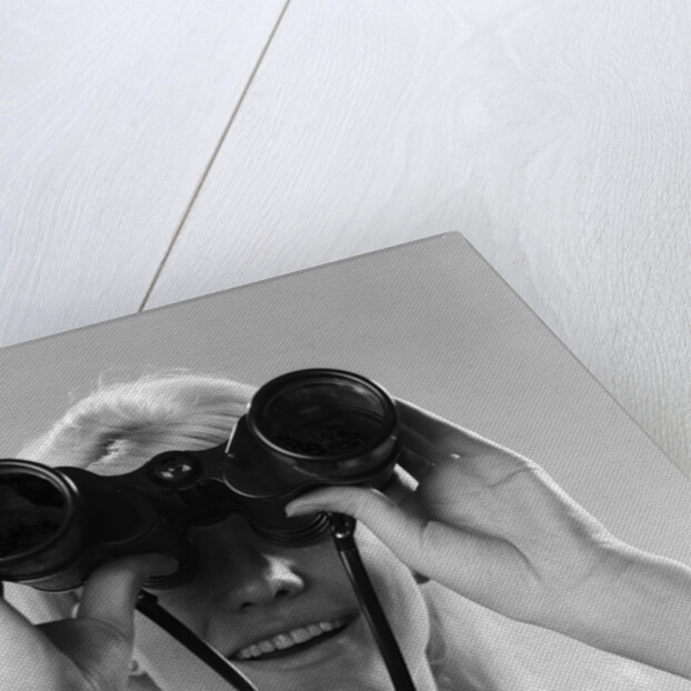 1960s Woman Looking Through Binoculars by Anonymous