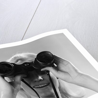 1960s Woman Looking Through Binoculars by Anonymous