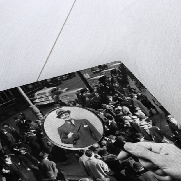 1930s 1940s Pedestrian Street Crowd Magnifying Glass Focused On Single Well Dressed Man by Anonymous