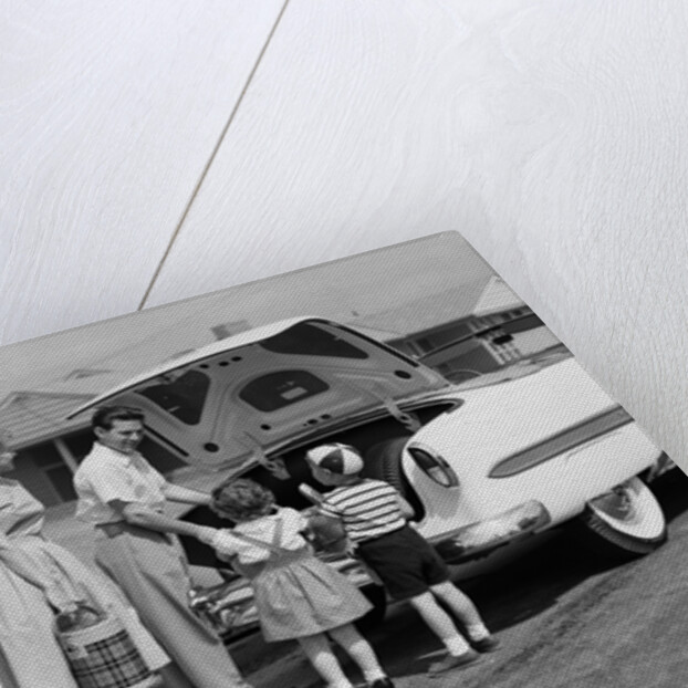 1950s Family Packing Trunk Of Car For A Picnic by Anonymous
